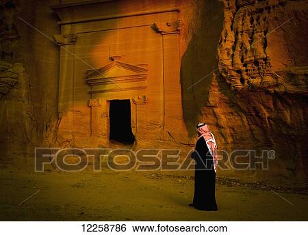 Stock Photograph - Pre-Islamic archaeological site; Madain Saleh, Saudi Arabia. Fotosearch
