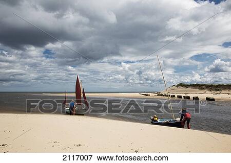 Stock Photo - Preparing Sailboats At The Water's Edge; Alnmouth Northumberland England. Fotosearch