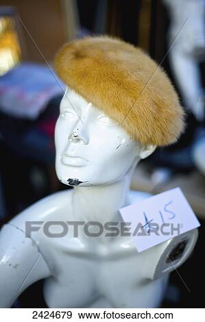 Stock Photo - Price tag on an old mannequin wearing a fur hat, Portobello Market; London, England. Fotosearch