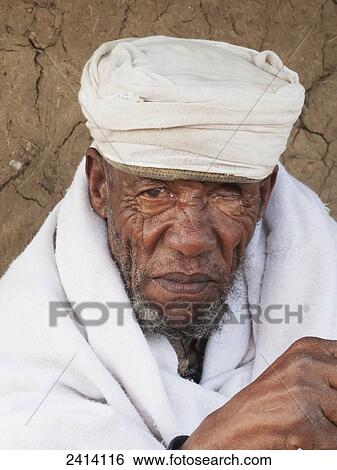 Stock Photograph - Priest, Asheten Maryam church; Lalibela, Amhara region, Ethiopia. Fotosearch