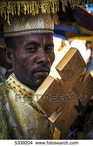Priest with cross; Lalibela, Ethiopia View Large Photo Image Picture - Priest with cross; Lalibela, Ethiopia. Fotosearch
