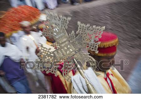 Stock Image - Priests parading around the churches of Lalibela during Orthodox Easter; Lalibela, Ethiopia. Fotosearch