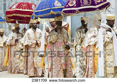 Priests parading copies of the Tabot (the tablets of stone) during Timkat (Epiphany) outside The Church of Our Lady Mary of Zion; Axum, Tigray, Ethiopia View Large Photo Image Stock Photo - Priests parading copies of the Tabot (the tablets of stone) during Timkat (Epiphany) outside The Church of Our Lady Mary of Zion; Axum, Tigray, Ethiopia. Fotosearch