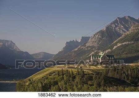 Prince Of Wales Hotel At Sunrise With Mountains In The Background; Waterton, Alberta, Canada View Large Photo Image Stock Image - Prince Of Wales Hotel At Sunrise With Mountains In The Background; Waterton, Alberta, Canada. Fotosearch