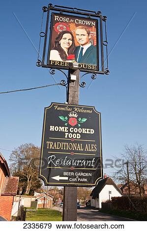Stock Photo - Prince William And Catherine, Duchess Of Cambridge Painted On Pub Sign At High Street; Tilshead, Wiltshire, England, Uk. Fotosearch