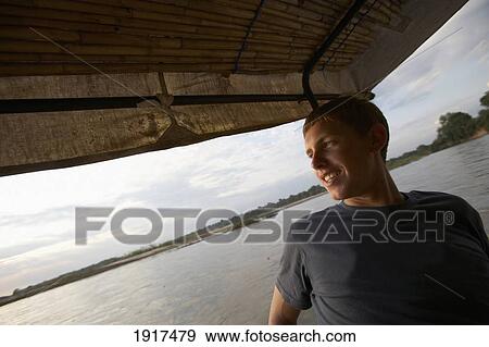 Pro Surfer On Boat Trip View Large Photo Image Stock Photo - Pro Surfer On Boat Trip. Fotosearch