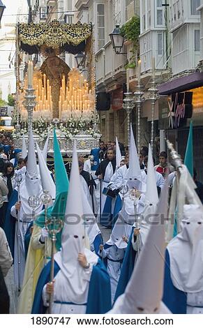 Stock Photo - Procession Through Alleys Of Cadiz During Semana Santa Easter Festival. Fotosearch