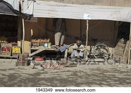 Produce Vendor At The Bazaar In Bamiyan, Bamian Province, Afghanistan View Large Photo Image Stock Photo - Produce Vendor At The Bazaar In Bamiyan, Bamian Province, Afghanistan. Fotosearch
