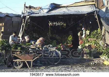 Produce Vendor At The Jalalabad Bazaar, Nangarhar Province, Afghanistan View Large Photo Image Stock Photo - Produce Vendor At The Jalalabad Bazaar, Nangarhar Province, Afghanistan. Fotosearch