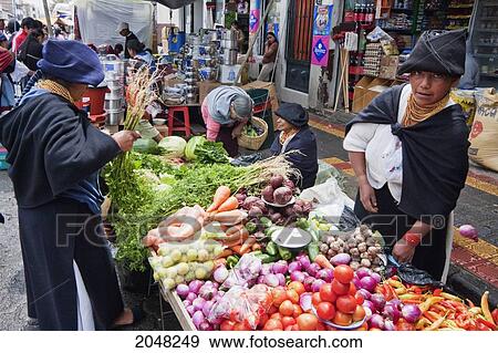 Stock Photo - Produce Vendor At The Saturday Market, Otavalo, Imbabura, Ecuador. Fotosearch