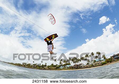 Stock Photo - Professional kiteboarder Chris Burke kiteboarding on the South shore of Maui; Maui, Hawaii, United States of America. Fotosearch