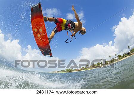 Picture - Professional kiteboarder Niccolo Porcella kiteboarding on the South shore of Maui; Maui, Hawaii, United States of America. Fotosearch