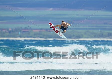 Stock Image - Professional kiteboarder Niccolo Porcella kitesurfing on the north shore of Maui; Maui, Hawaii, United States of America. Fotosearch