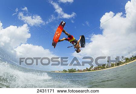 Professional kiteboarder Niccolo Porcella kiteboarding on the South shore of Maui; Maui, Hawaii, United States of America View Large Photo Image Stock Image - Professional kiteboarder Niccolo Porcella kiteboarding on the South shore of Maui; Maui, Hawaii, United States of America. Fotosearch