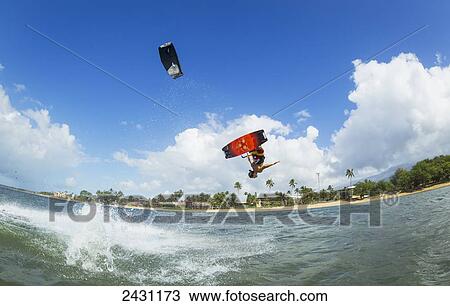 Stock Image - Professional kiteboarder Niccolo Porcella kiteboarding on the South shore of Maui; Maui, Hawaii, United States of America. Fotosearch