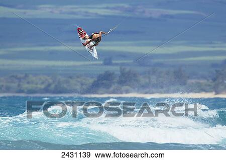 Stock Photo - Professional kiteboarder Niccolo Porcella kiteboarding on the north shore of Maui; Maui, Hawaii, United States of America. Fotosearch