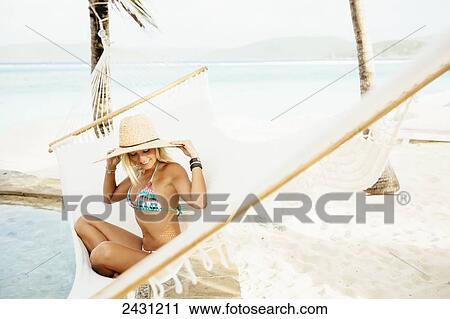 Professional kiteboarder Susi Mai relaxing in the hammock enjoying the island lifestyle; Necker Island, British Virgin Islands View Large Photo Image Stock Image - Professional kiteboarder Susi Mai relaxing in the hammock enjoying the island lifestyle; Necker Island, British Virgin Islands. Fotosearch