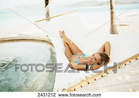 Professional kiteboarder Susi Mai relaxing in the hammock enjoying the island lifestyle; Necker Island, British Virgin Islands View Large Photo Image Stock Image - Professional kiteboarder Susi Mai relaxing in the hammock enjoying the island lifestyle; Necker Island, British Virgin Islands. Fotosearch