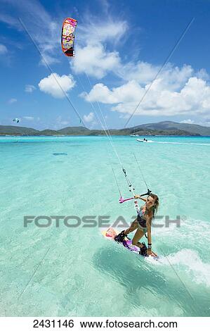 Professional kiteboarder Susi Mai kitesurfing over the crystal blue waters; Necker Island, British Virgin Islands View Large Photo Image Stock Photograph - Professional kiteboarder Susi Mai kitesurfing over the crystal blue waters; Necker Island, British Virgin Islands. Fotosearch