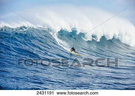Professional surfer Kai Lenny paddling into large waves at the infamous big wave spot know as Jaws or Peahi; Maui, Hawaii, United States of America View Large Photo Image Stock Image - Professional surfer Kai Lenny paddling into large waves at the infamous big wave spot know as Jaws or Peahi; Maui, Hawaii, United States of America. Fotosearch
