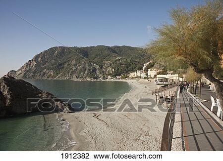 Stock Image - Promenade Along A Beach On The Coast; Monterosso Al Mare, Liguria, Italy. Fotosearch
