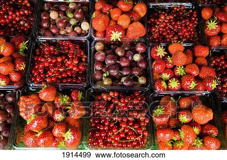 Stock Photo - Property Release Not Required; Strawberries And Raspberries For Sale, Norfolk, England. Fotosearch