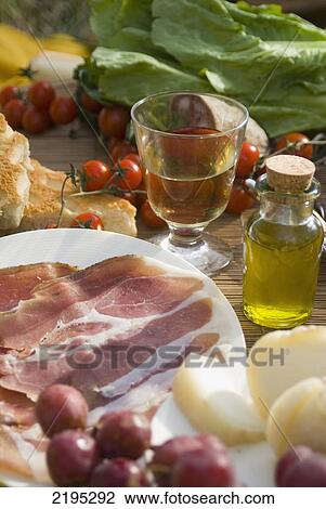 Prosciutto Ham, Cheese, Tomatoes, White Wine And Other Ingredients For A Picnic In Tuscany, Italy. View Large Photo Image Stock Image - Prosciutto Ham, Cheese, Tomatoes, White Wine And Other Ingredients For A Picnic In Tuscany, Italy.. Fotosearch