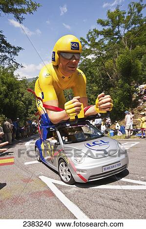 Publicity caravans on the road handing out gifts to the crowd at the Tour de France; Pyrenees, France View Large Photo Image Stock Image - Publicity caravans on the road handing out gifts to the crowd at the Tour de France; Pyrenees, France. Fotosearch