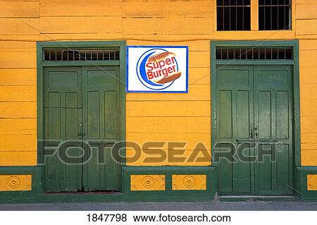 Stock Photo - Puerto Corinto, Chinandega, Nicaragua, Central America; Green Doors Of Storefront. Fotosearch