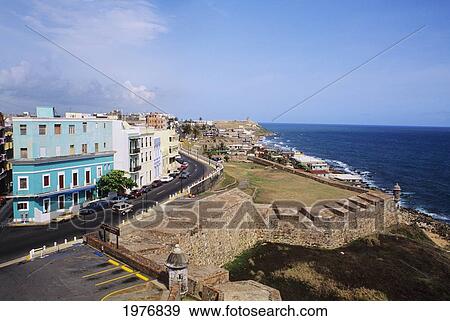 Stock Photo - Puerto Rico, El Morro; Old San Juan, Buildings Along Coastline. Fotosearch