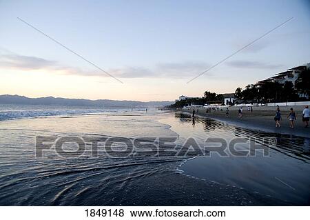 Puerto Vallarta, Mexico; People Walking Along Seashore View Large Photo Image Stock Photo - Puerto Vallarta, Mexico; People Walking Along Seashore. Fotosearch