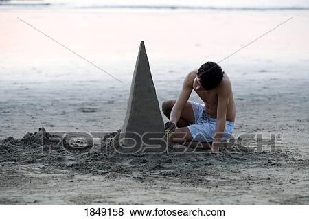 Puerto Vallarta, Mexico; Young Man Building Sand Sculpture View Large Photo Image Stock Photo - Puerto Vallarta, Mexico; Young Man Building Sand Sculpture. Fotosearch