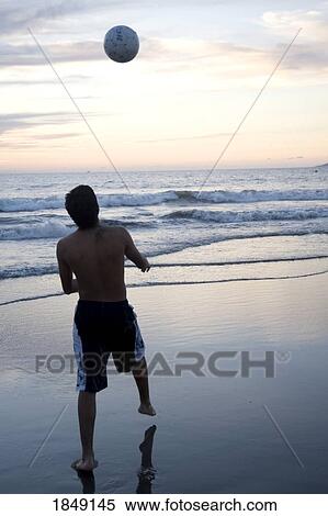 Puerto Vallarta, Mexico; Young Man With Ball On Beach View Large Photo Image Stock Photography - Puerto Vallarta, Mexico; Young Man With Ball On Beach. Fotosearch