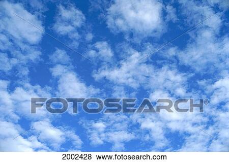 Puffs Of Small Clouds, Alto-Cumulus Scattered In Blue Sky View Large Photo Image Stock Photo - Puffs Of Small Clouds, Alto-Cumulus Scattered In Blue Sky. Fotosearch