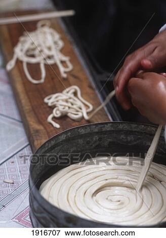 Stock Photo - Pulling Out Dough For Making Noodles ÃƒÆ’Ã‚Â¡. Fotosearch