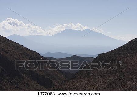 Puquios With Olca Volcano In The Background, Antofagasta Region, Chile View Large Photo Image Stock Image - Puquios With Olca Volcano In The Background, Antofagasta Region, Chile. Fotosearch