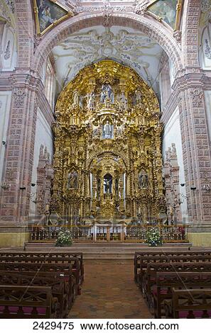 Stock Photography - Pure gold alter and back wall of an ancient spanish cathedral; Guanajuato, Mexico. Fotosearch