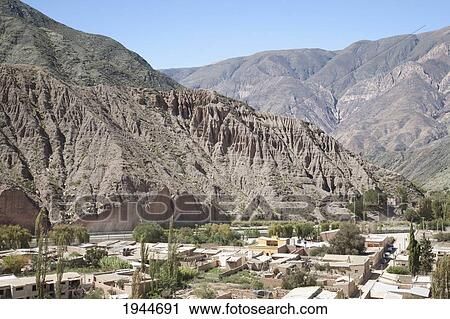 Stock Image - Purmamarca and the Upper Cretaceous Yacoraite Formation of Cerro de los Siete Colores (Hill of the Seven Colors), Jujuy, Argentina. Fotosearch