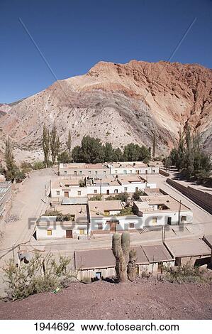 Stock Image - Purmamarca and the Upper Cretaceous Yacoraite Formation of Cerro de los Siete Colores (Hill of the Seven Colors), Jujuy, Argentina. Fotosearch