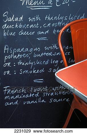 Stock Photo - Pygma-Lion, Menu Signboard, Red Table And Chair, Amsterdam, Netherlands.. Fotosearch