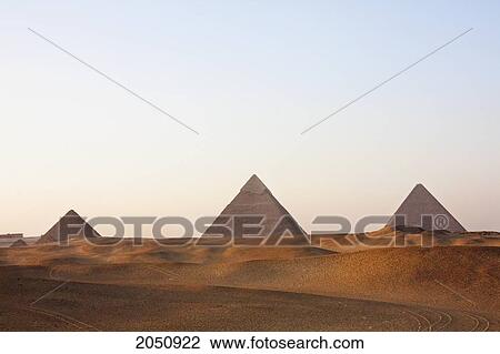 Stock Image - Pyramids Of Giza At Sunset, Al Jizah, Egypt. Fotosearch