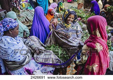 Stock Image - Qat sellers in a market just outside the old city of Harar in Eastern Ethiopia; Harar, Ethiopia. Fotosearch
