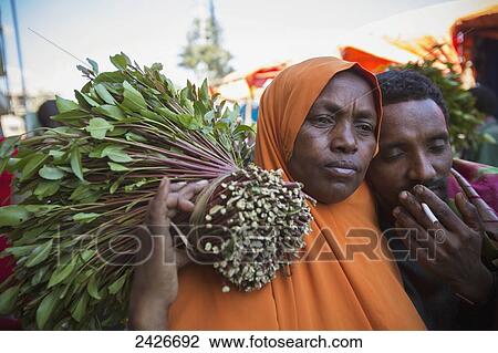 Qat sellers in a market just outside the old city of Harar in Eastern Ethiopia; Harar, Ethiopia View Large Photo Image Stock Image - Qat sellers in a market just outside the old city of Harar in Eastern Ethiopia; Harar, Ethiopia. Fotosearch
