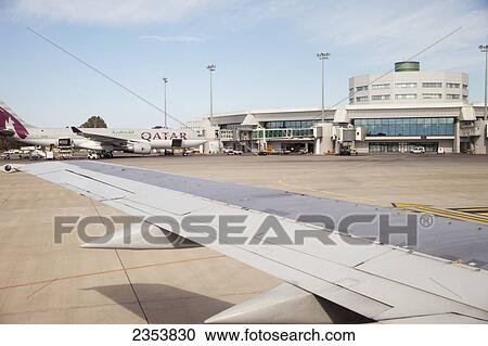 Stock Image - Qatar Airways aircraft at Algiers Houari Boumediene International airport; Algiers, Algeria. Fotosearch