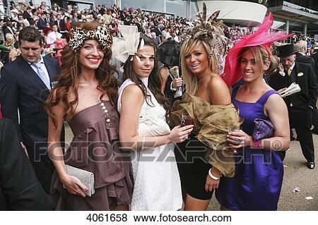 Stock Photo - Race goers at the Royal Ascot horse race meeting; Ascot, Berkshire, England. Fotosearch