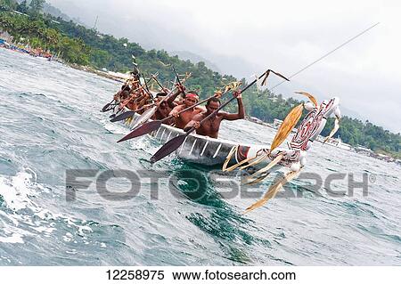 Racing in the Milne Bay Canoe Festival; Alatou, Milne Bay, Papua New Guinea View Large Photo Image Stock Photography - Racing in the Milne Bay Canoe Festival; Alatou, Milne Bay, Papua New Guinea. Fotosearch