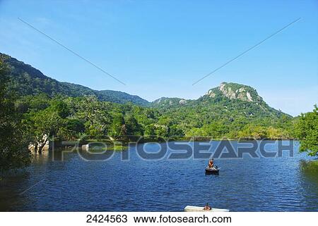 Rafting on a tranquil lake; Ulpotha, Embogama, Sri Lanka View Large Photo Image Stock Image - Rafting on a tranquil lake; Ulpotha, Embogama, Sri Lanka. Fotosearch