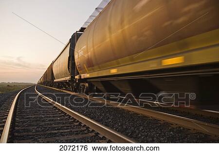 Stock Photograph - Rail Hopper Cars On The Move, Near Winnipeg, Manitoba. Fotosearch