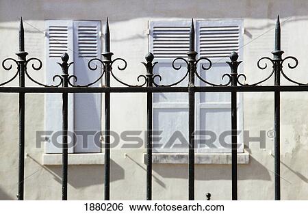 Stock Photograph - Railings And Shutters On Square Leopold Aquille, Malais District. Fotosearch