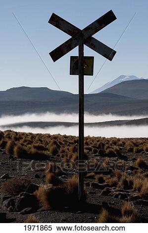 Railway Crossing With The Salar De Alconcha Salt Pan Covered By Fog In The Background Near Yuma, Antofagasta Region, Chile View Large Photo Image Stock Photography - Railway Crossing With The Salar De Alconcha Salt Pan Covered By Fog In The Background Near Yuma, Antofagasta Region, Chile. Fotosearch